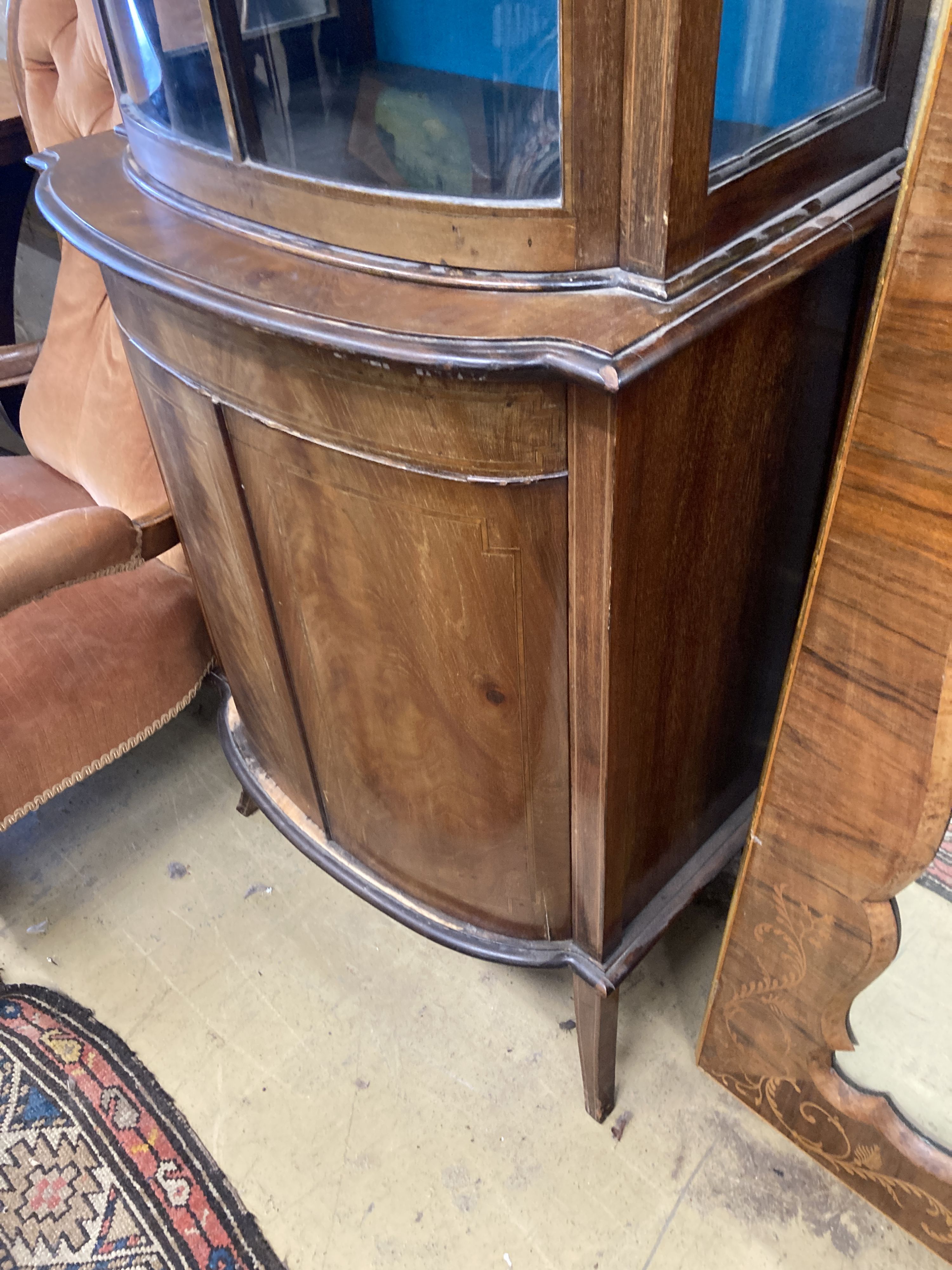 An Edwardian mahogany bowfront narrow display cabinet, width 60cm, depth 36cm, height 164cm